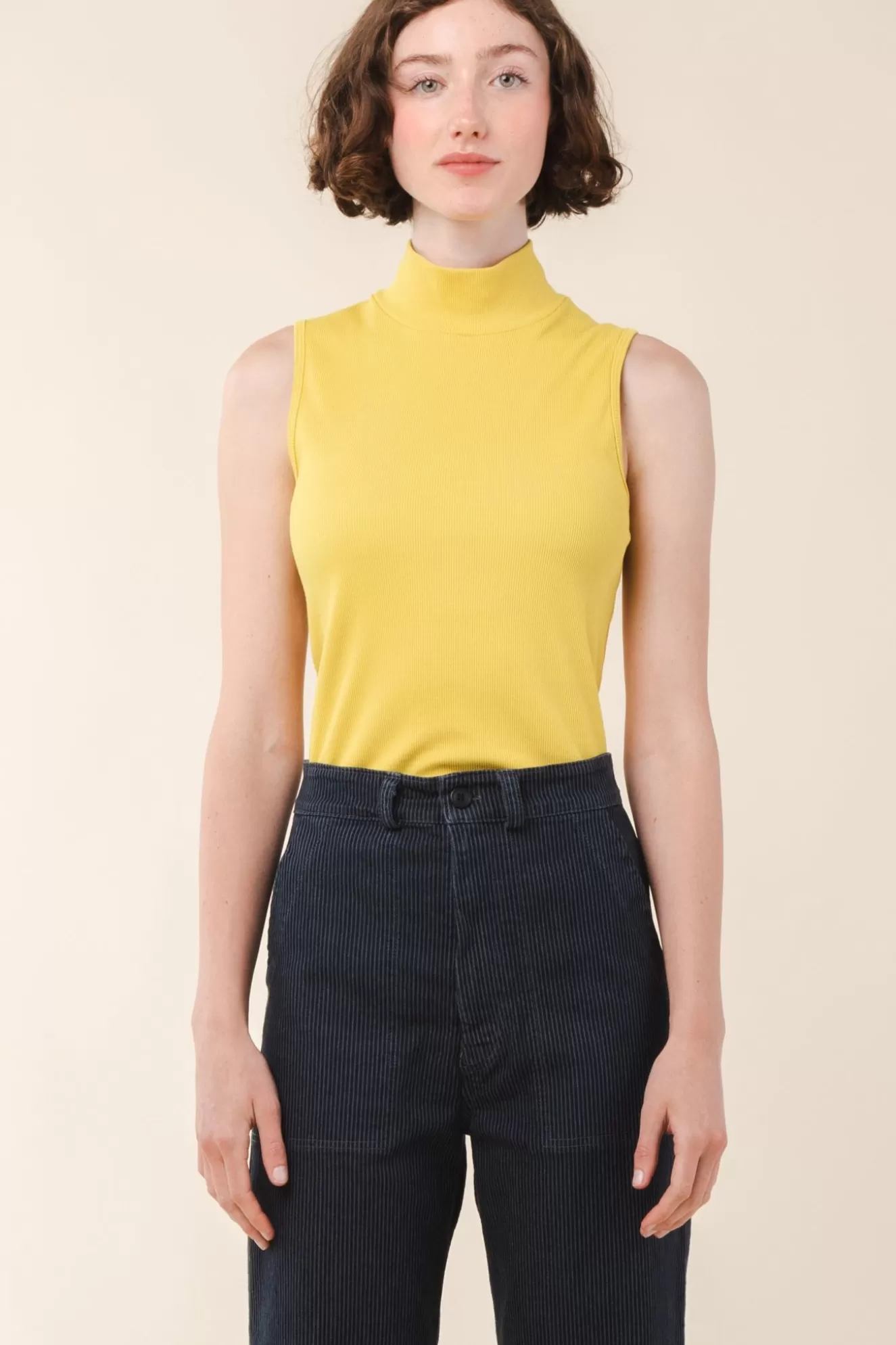 Fashion Sleeveless Mockneck In Taxi Women Tops